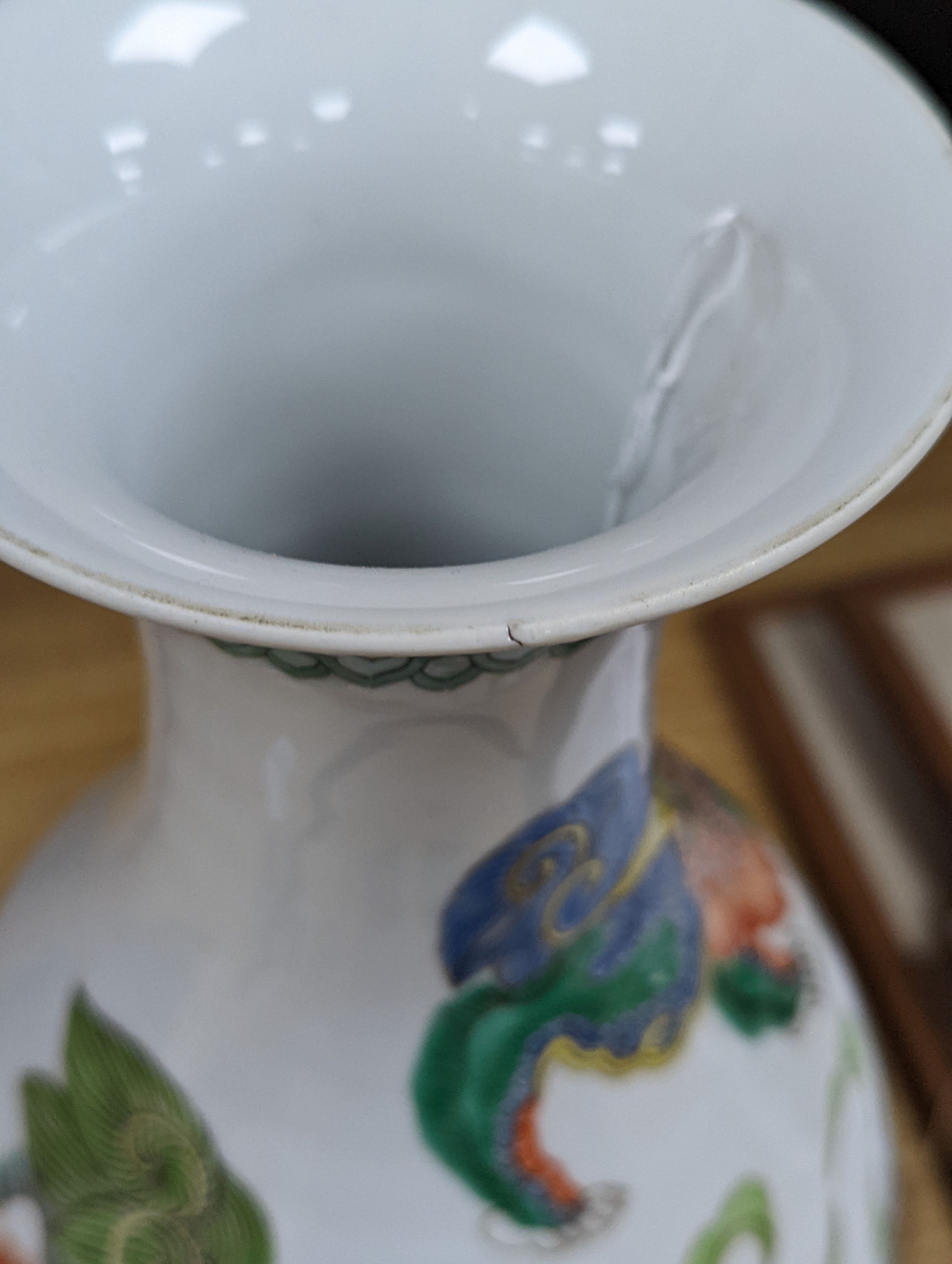 A Chinese famille verte pear shaped ‘Buddhist lion’ vase, on stand, 32 cms high not including stand.